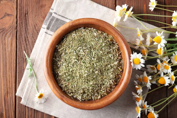 Bowl with dry wild chamomile flowers — Stock Photo, Image