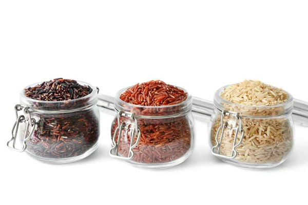 Different types of rice in glass jars — Stock Photo, Image