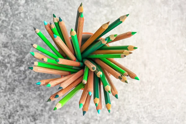 Sharp green pencils in cup