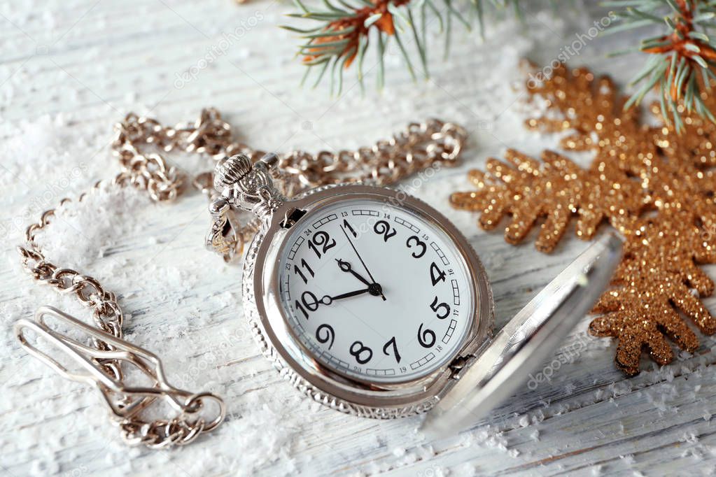 Watch and decorations on table