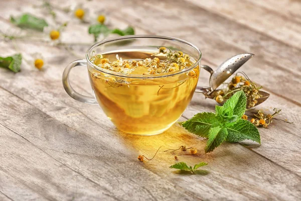 Glass cup of chamomile tea — Stock Photo, Image