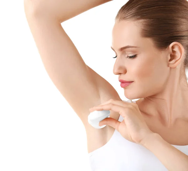 Beautiful young woman with deodorant — Stock Photo, Image