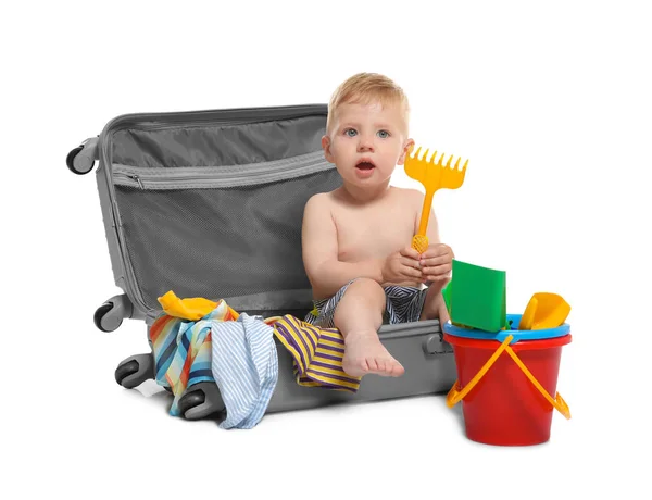 Baby sitting in suitcase on white background — Stock Photo, Image