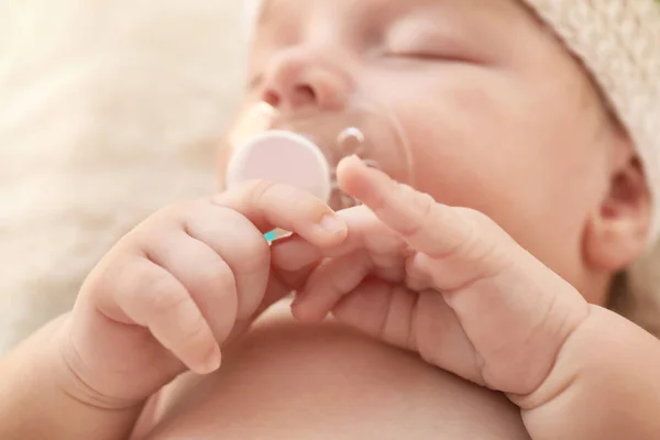 Cute little baby with pacifier sleeping at home, closeup — Stock Photo, Image