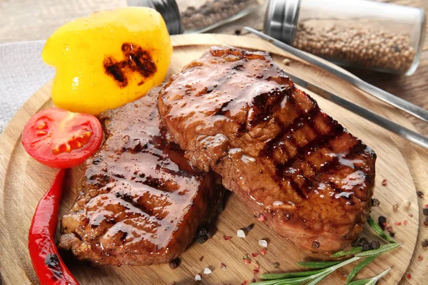 Tasty grilled steaks — Stock Photo, Image