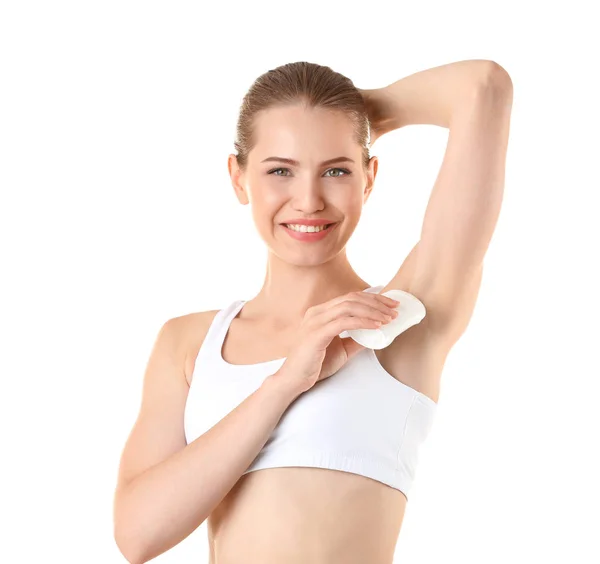 Mooie jonge vrouw met deodorant — Stockfoto