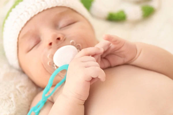 Cute little baby with pacifier sleeping at home, closeup — Stock Photo, Image