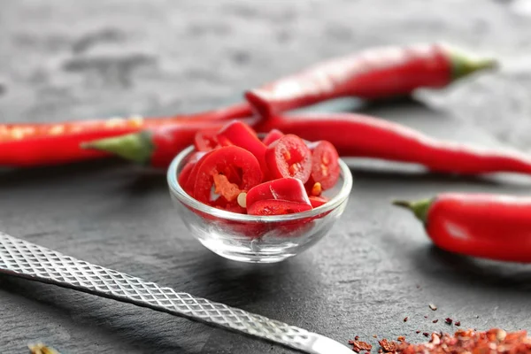 Red chili pepper slices in bowl — Stock Photo, Image