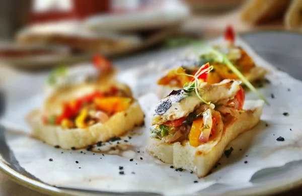 Delicious molletes with fillet of fish — Stock Photo, Image