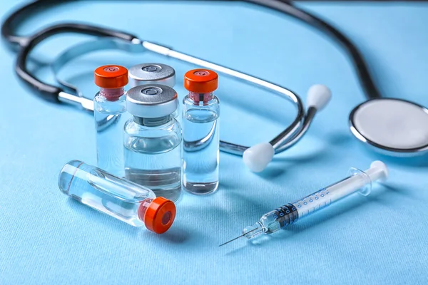 Ampules, syringe and stethoscope — Stock Photo, Image