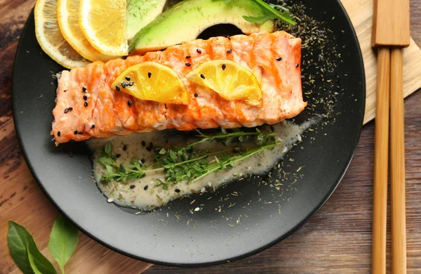 Plate with slice of delicious salmon — Stock Photo, Image