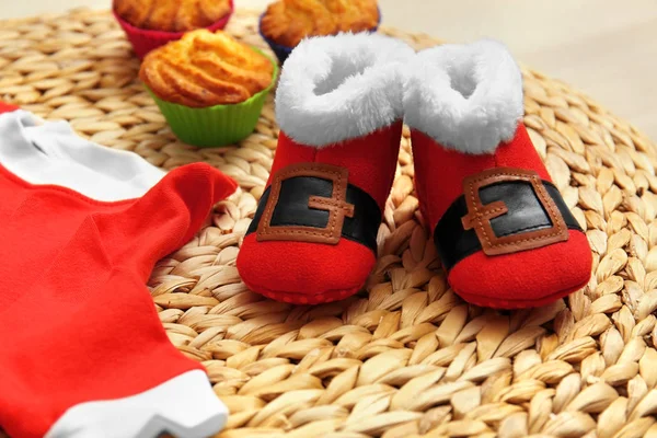 Christmas booties and muffins — Stock Photo, Image