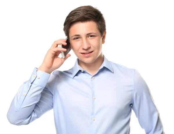 Schattige tiener jongen met mobiele telefoon op witte achtergrond — Stockfoto