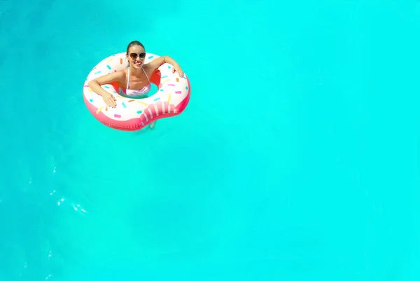 Woman with inflatable donut — Stock Photo, Image