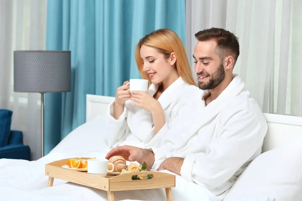 Young couple having breakfast