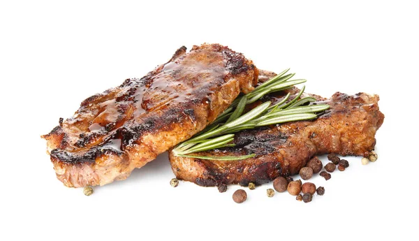 Tasty steaks with rosemary — Stock Photo, Image