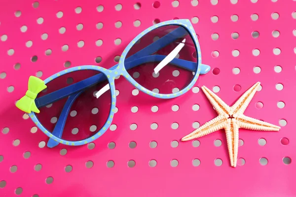 Beautiful sunglasses on color background — Stock Photo, Image