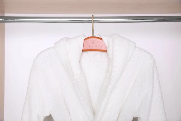 Bathrobe hanging in wardrobe — Stock Photo, Image