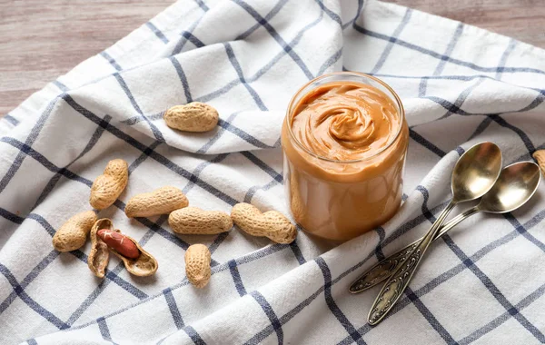 Jar with creamy peanut butter — Stock Photo, Image