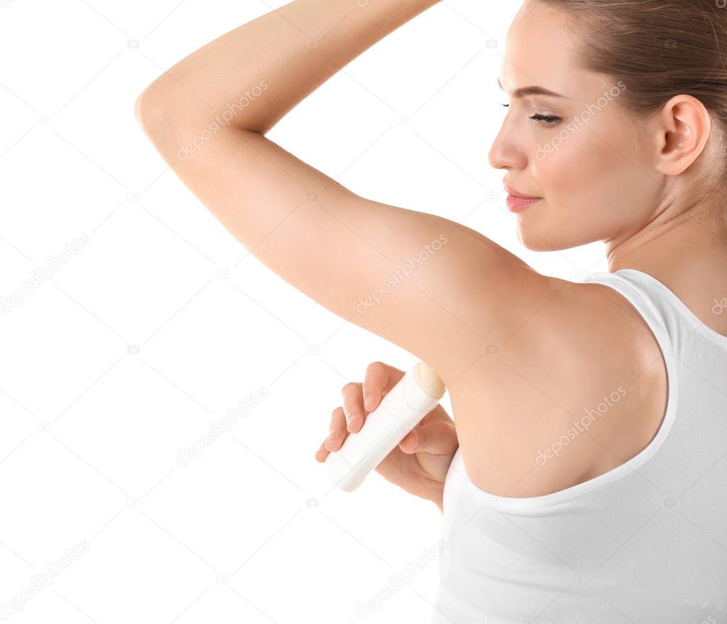 Beautiful young woman with deodorant 