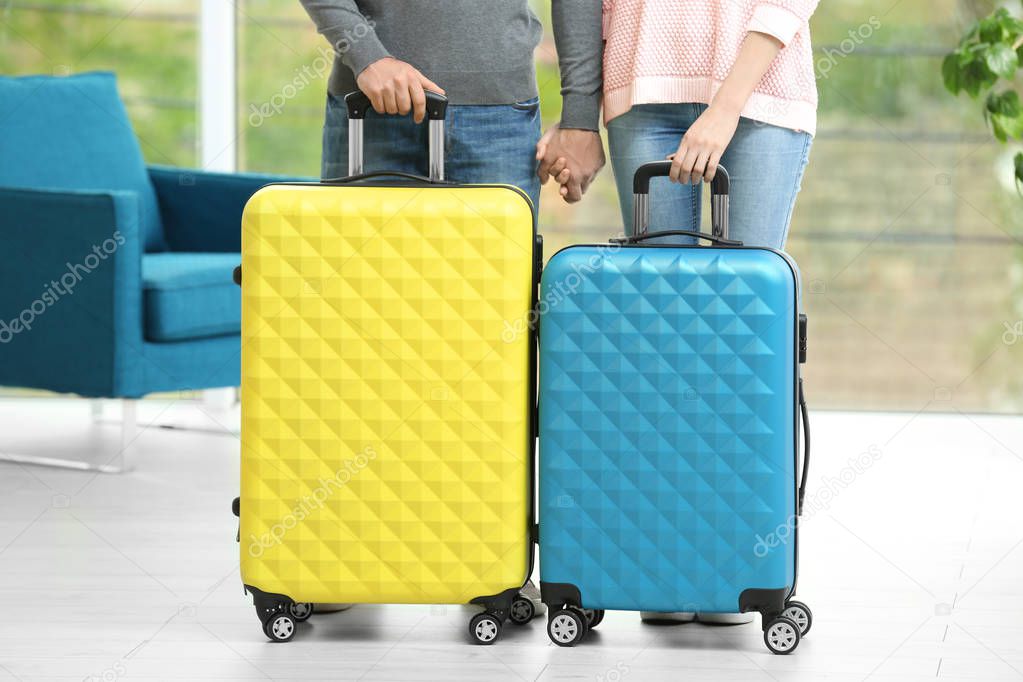 Young couple with luggage 