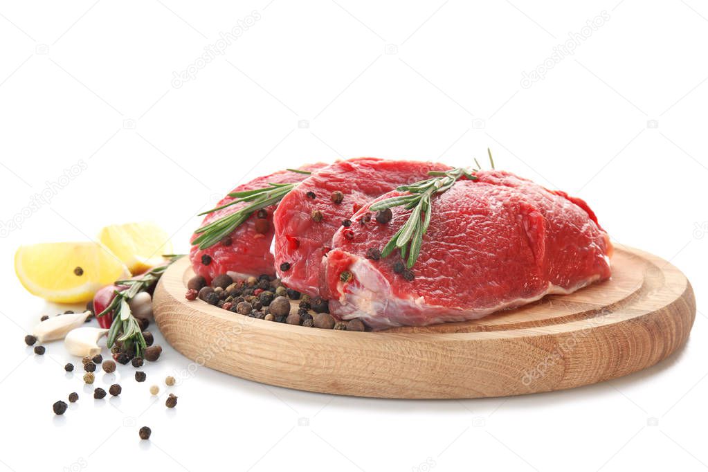 Wooden board with fresh raw meat 