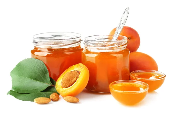 Apricot jam in jars and bowls — Stock Photo, Image