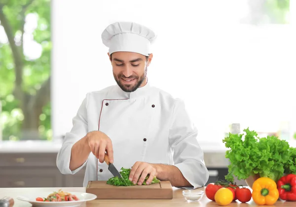 Chef holding cooked dish — Stock Photo, Image