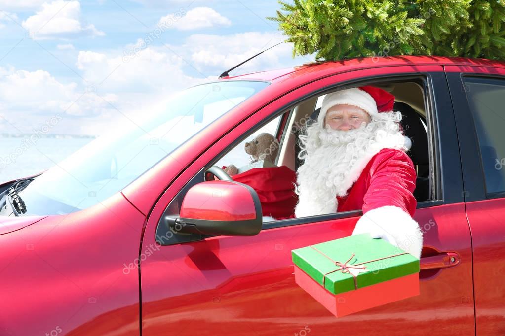 Santa Claus  in red car