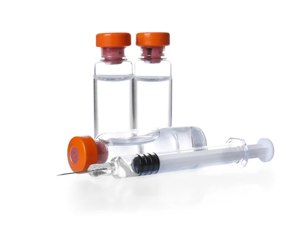 Ampules with vaccine and syringe — Stock Photo, Image