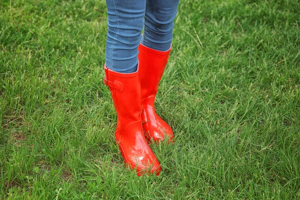 Young woman in red rubber boots — Stock Photo, Image