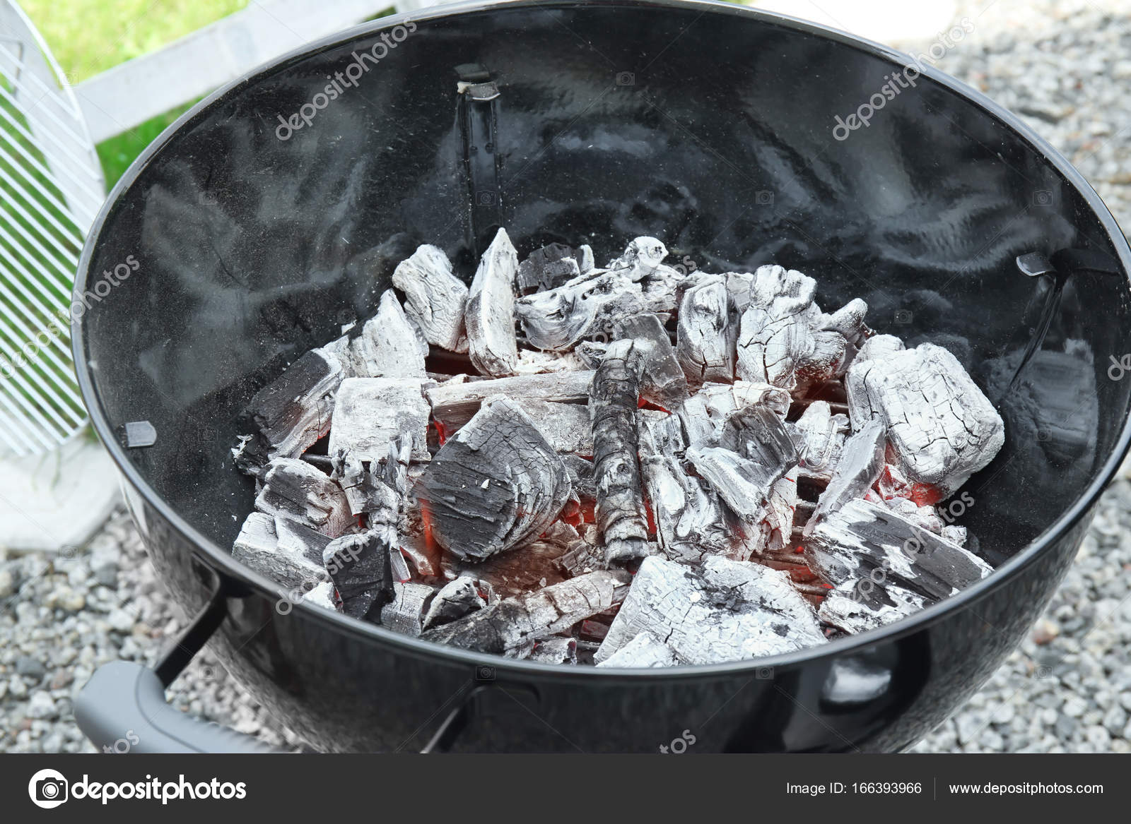 Barbecue grill with firewood — Stock Photo © belchonock 166393966