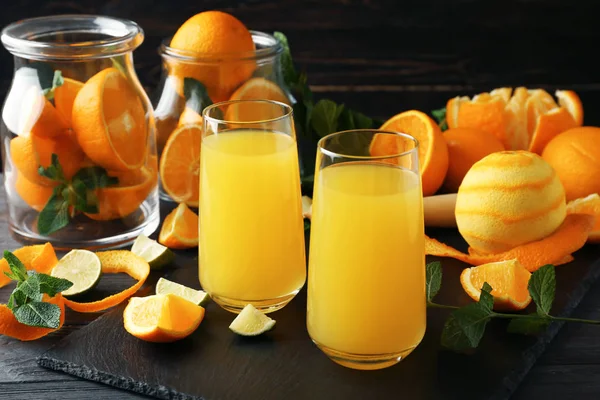 Delicious orange juice and ingredients — Stock Photo, Image