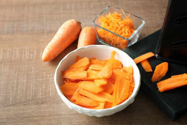Bowl with sliced carrot — Stock Photo, Image