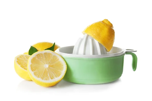 Composition with cut lemons and plastic juicer — Stock Photo, Image