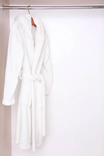 Bathrobe hanging in wardrobe — Stock Photo, Image