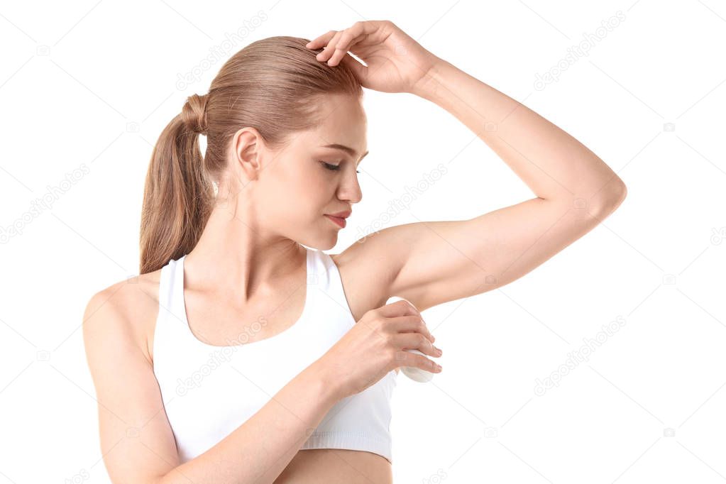 Beautiful young woman with deodorant 