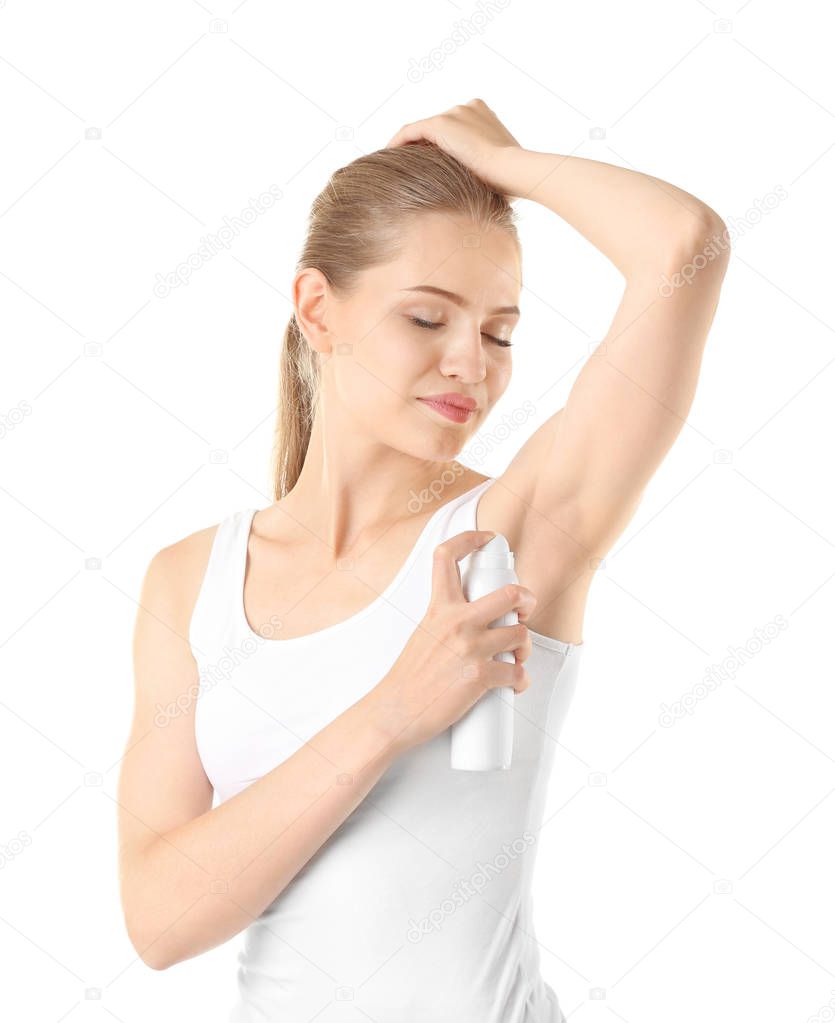 Beautiful young woman with deodorant 