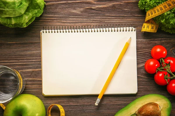 Empty notebook and set of healthy food — Stock Photo, Image