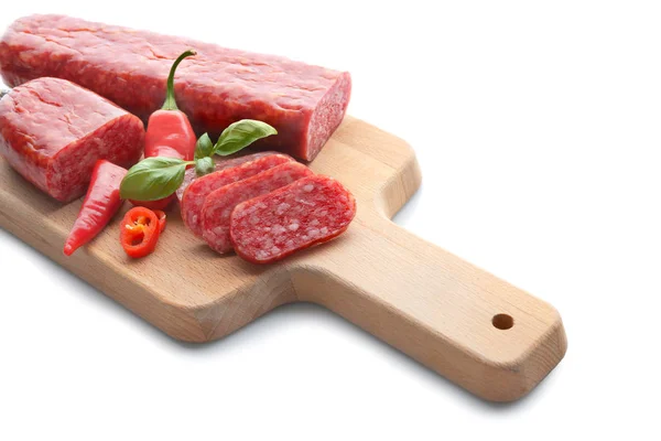 Wooden board with delicious sliced sausage and chili pepper on white background — Stock Photo, Image