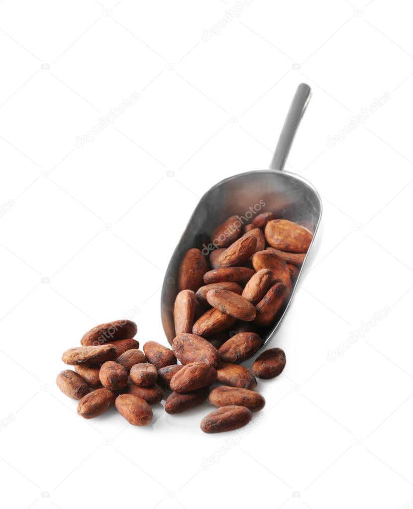 Metal scoop with aromatic cocoa beans on white background