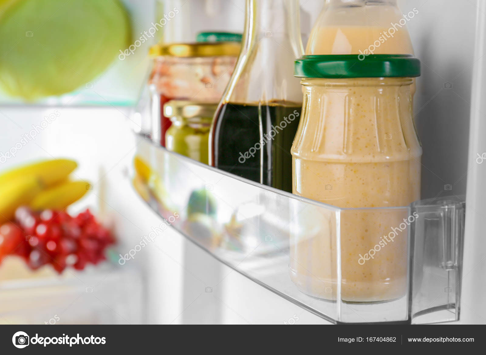 Different sauces in fridge — Stock Photo © belchonock 167404862