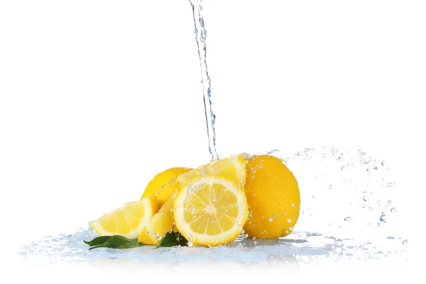 Fresh lemons with jet of water — Stock Photo, Image