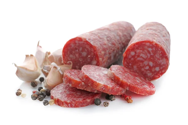 Delicious sliced sausage with garlic and peppers on white background — Stock Photo, Image