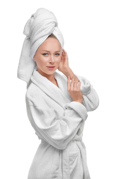 Beautiful young woman in bathrobe after shower on white background — Stock Photo, Image