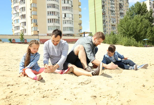 Male Gay Couple Children Playing Sand — Stock Photo, Image