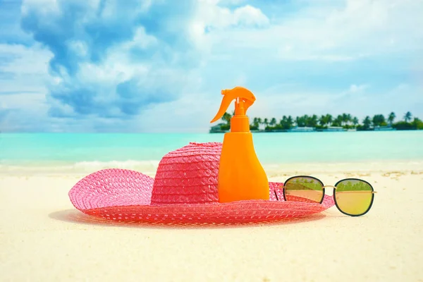 Beach accessories on sand at sea resort. Summer vacation concept