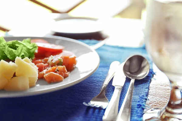 Plate with tasty meal on table — Stock Photo, Image