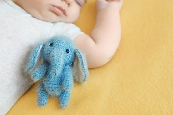 Cute little baby sleeping with toy on bed — Stock Photo, Image