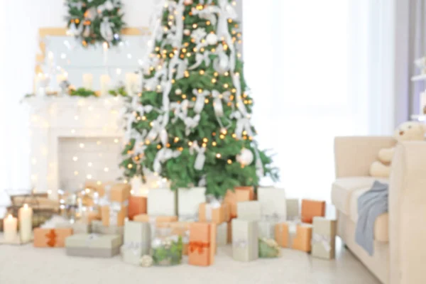 Blurred view of beautiful fir tree in decorated for Christmas room — Stock Photo, Image